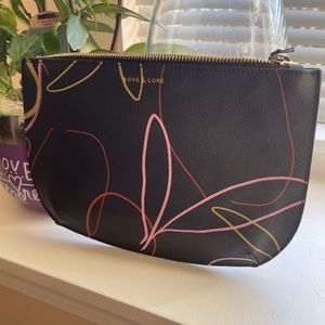 Small pouch or can be used as a clutch.